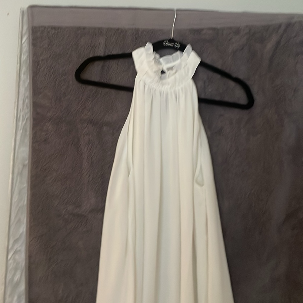 Halter top-cream colored.  Sleeveless. Worn once.  Runs big.   Blousy fit.